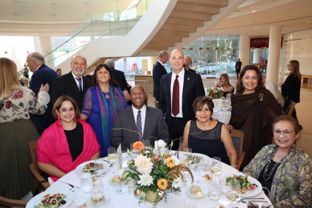 Guests at a circular dinner table at the OC Arts Awards