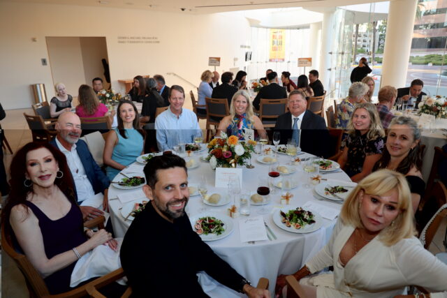 Guests at a circular dinner table at the OC Arts Awards
