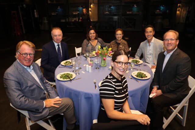 Guests at the VIP Luncheon smile for the camera