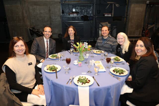 Guests at a circular table for a luncheon