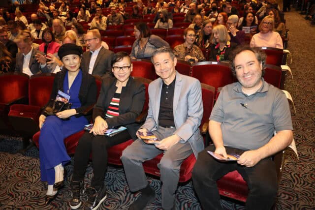 Four guests seated in the audience at the Barclay Theatre